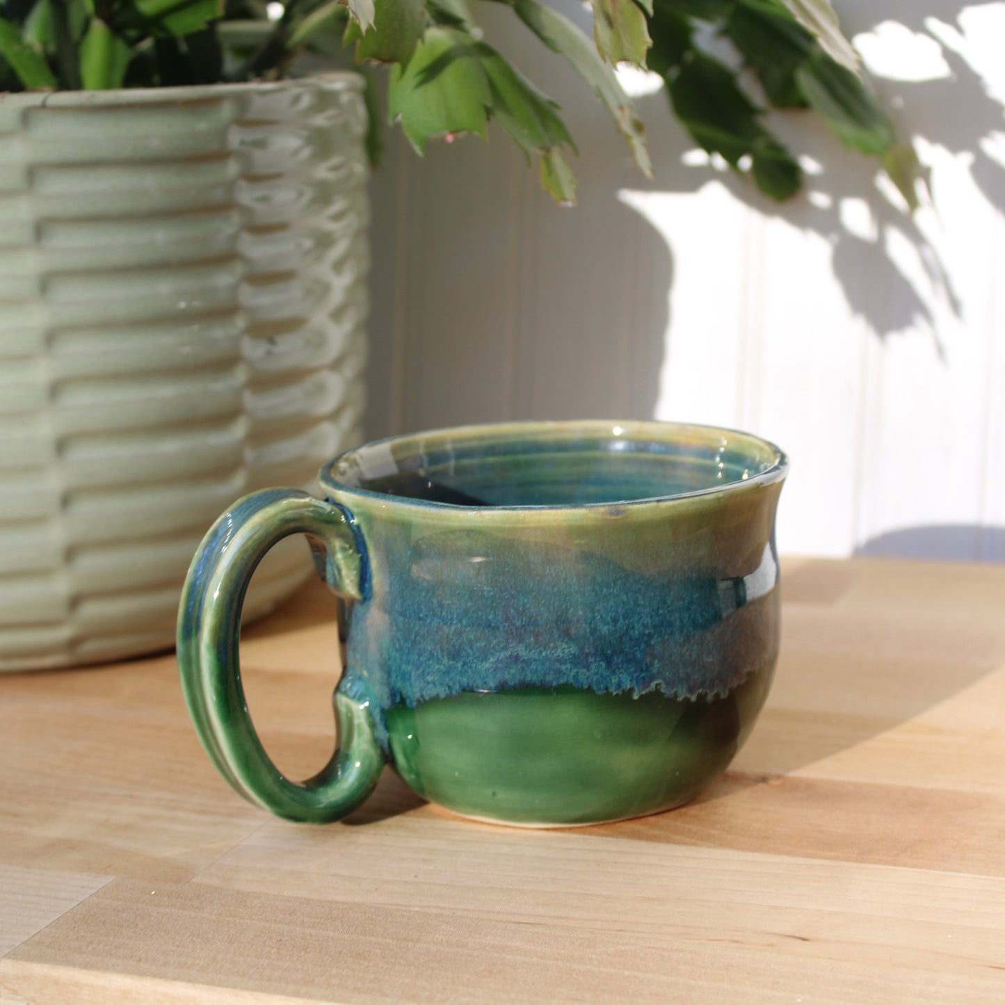 Green Mug with Blue Drip