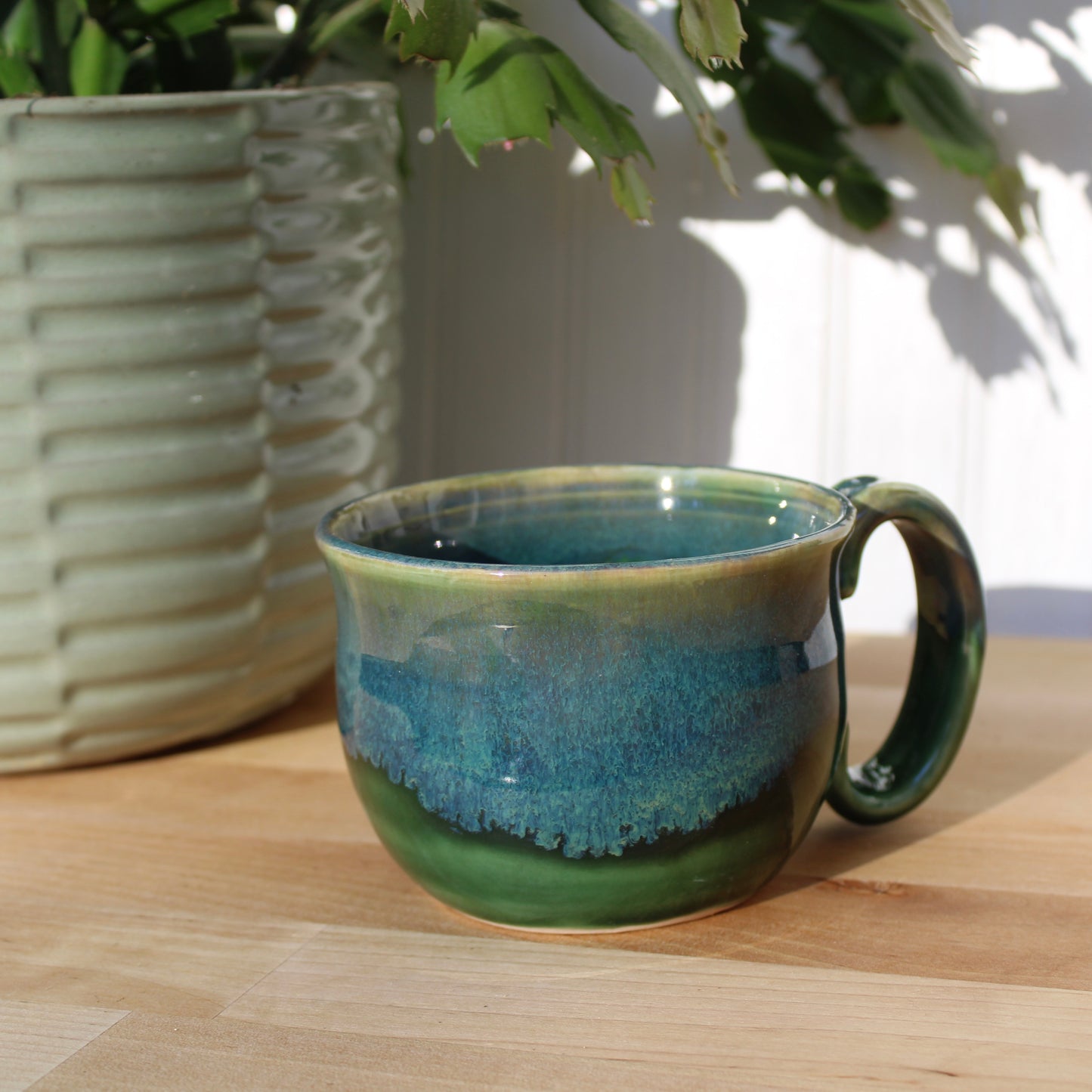 Green Mug with Blue Drip